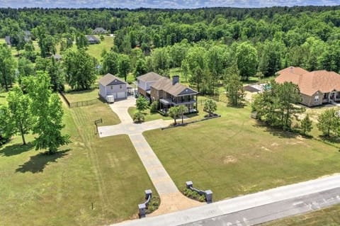 Aerial Front. Basketball goal on left middle driveway. 