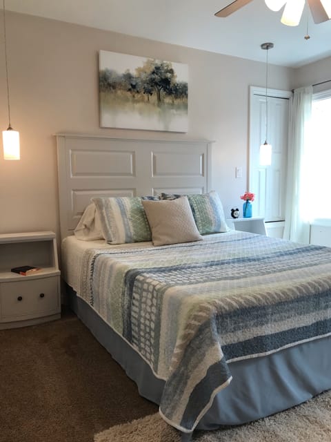 Soothing colors and soft bedding make this a great room for relaxation!