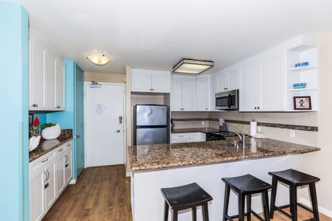 Bar seating for 3 and ample storage space