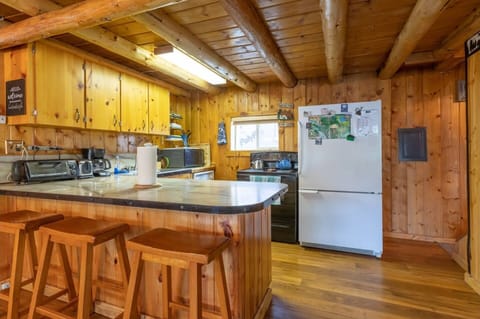 Kitchen is fully equipped with everything you need to whip up a tasty meal with friends and family. Seating at the large counter top invites conversation and memories to be made.
