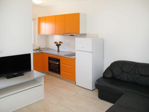 Room, Furniture, Property, Orange, Floor, Interior Design, Building, Cabinetry, Yellow, House