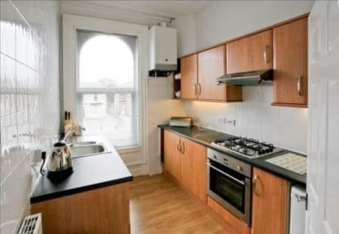 Modern fitted kitchen with hob & oven dishwasher fridge & freezer and microwave