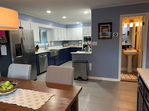 Breakfast table looking into kitchen area.  Half guest bath pictured