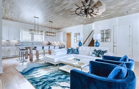 1st Floor -  A spacious open floor plan featuring a gourmet kitchen, living area, half bath, and laundry room a perfect gathering space.