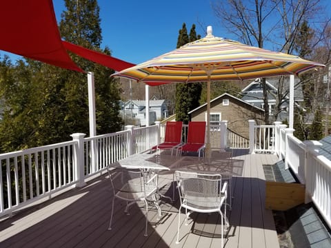 The upstairs back deck provides sun, shade and fresh breezes off the lake.
