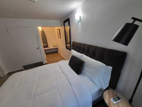 Full bed . Bedroom with air conditioner .