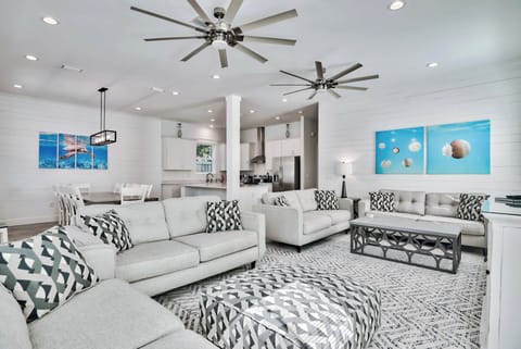Bright living room w/ comfy seating, coastal accents, & plenty of space to unwind.