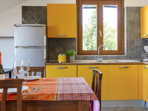 Countertop, Room, Furniture, Kitchen, Orange, Cabinetry, Yellow, Interior Design, Property, Floor