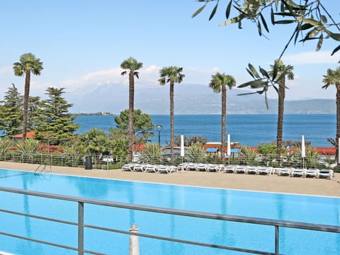 Water, Sky, Plant, Azure, Tree, Shade, Swimming Pool, Arecales, Seaside Resort, Coastal And Oceanic Landforms