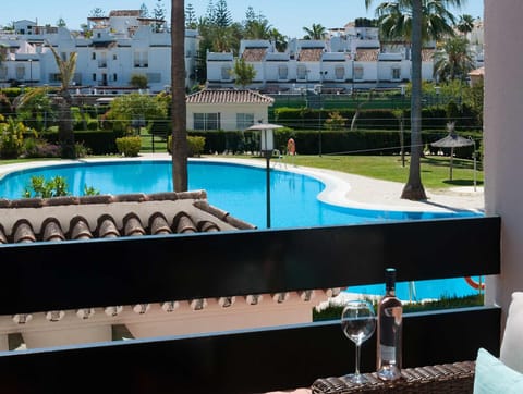 Cozy apartment terrace overlooking pool, Spain