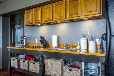Plenty of cooking ware, serving ware, glasses, utensils, and more are stocked in the fully-functional kitchen at the cabin!