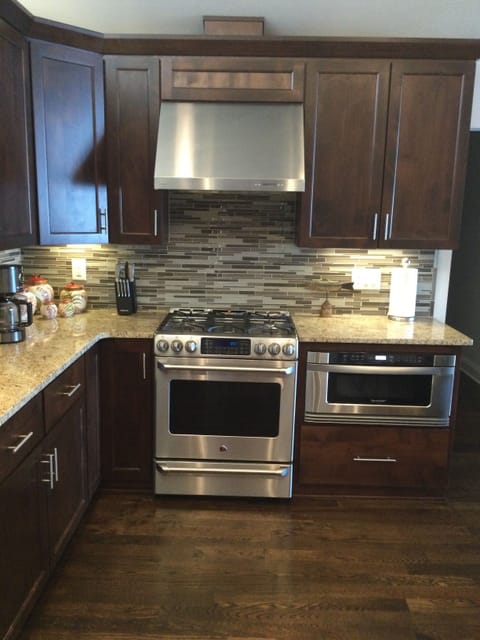 Gas oven and stove with warming drawer.  Microwave drawer.