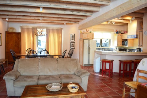 Living room view to back patio and open kitchen