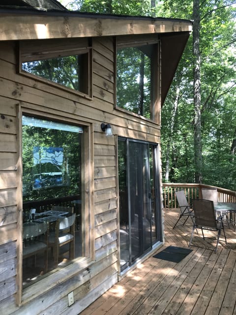 Wrap-around porch on side and back of home partially screened in.