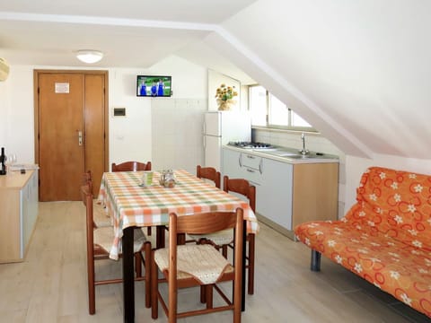 Table, Furniture, Cabinetry, Chair, Wood, Interior Design, Orange, Building, Comfort, Drawer