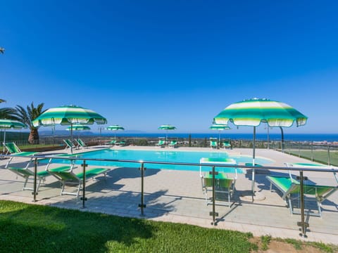 Water, Sky, Plant, Swimming Pool, Umbrella, Outdoor Furniture, Shade, Tree, Natural Landscape, Aqua