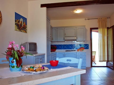 Furniture, Property, Cabinetry, Table, Countertop, Azure, Interior Design, Orange, Architecture, Kitchen