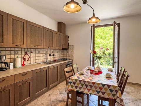 Cabinetry, Furniture, Property, Countertop, Table, Wood, Interior Design, Chair, Lighting, Kitchen