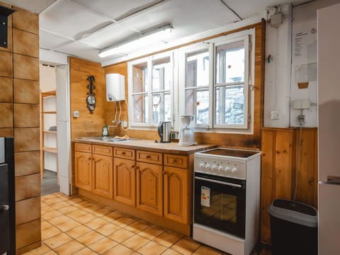 Kitchen, Countertop, Cabinetry, Flooring, Wood, Kitchen Appliance, Major Appliance, Interior Design, Furniture, Floor