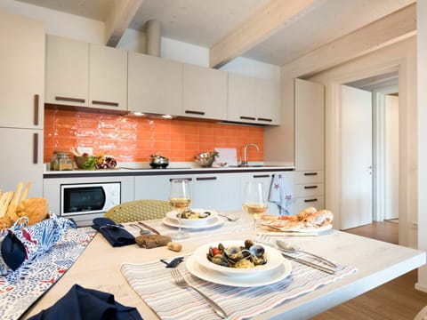 Food, Property, Table, Tableware, Furniture, Orange, Interior Design, Cabinetry, Countertop