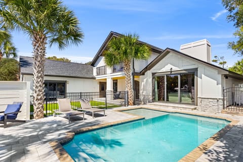 pool with lounge chairs
