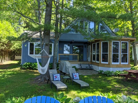 Lake view of Clearly Ours - level property with screened in Muskoka room