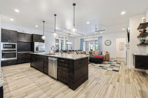 Spacious main floor living area with kitchen, living, and dining rooms all together