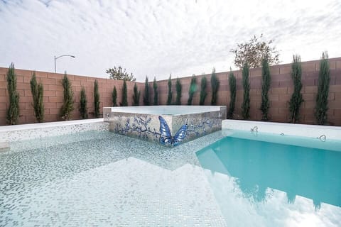 Beautifully appointed mosaic pool + jacuzzi 