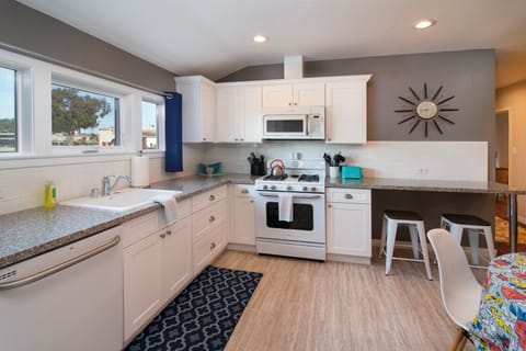Kitchen features full size appliances including a dishwasher