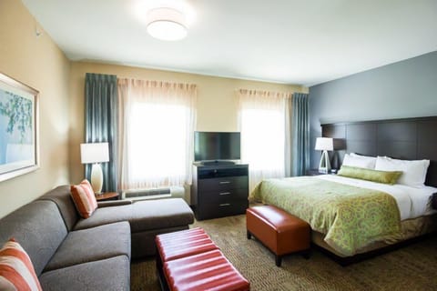 King bed with nightstands and seating area