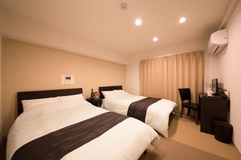This is a room with two semi-double beds.