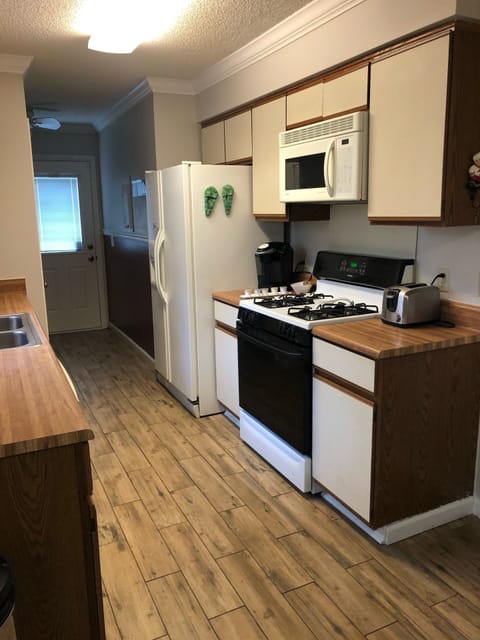 Stove/Refrigerator side of Galley Kitchen