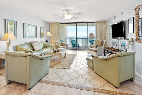 Living room with ocean views and balcony doors at Ocean Bay Club 703, a 3-bedroom rental from Thomas Beach Vacations