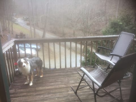 private deck with rockers, looking toward barn area