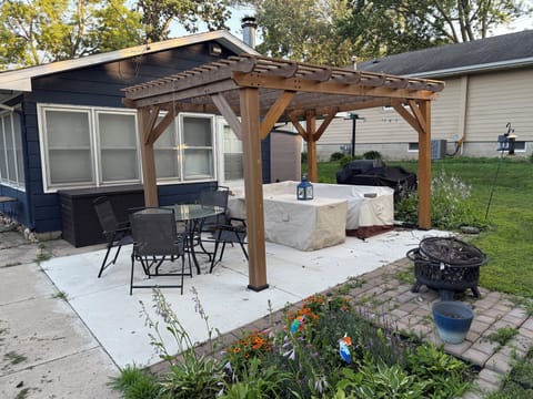 Back patio with grill, griddle, fire pit and patio furniture