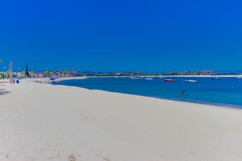 Relax on the bay as you gaze at sailboats drifting on the crystal blue waters