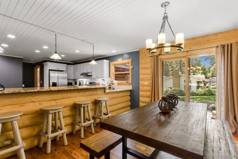 Large dining table and island seating with access to outside.