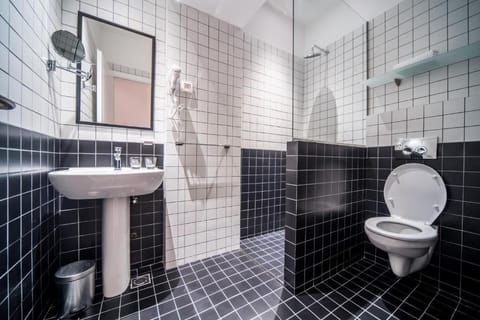 Bathroom has a modern design. 
