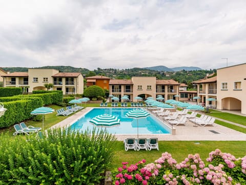 Water, Sky, Cloud, Swimming Pool, Azure, Plant, Building, Body Of Water, Outdoor Furniture
