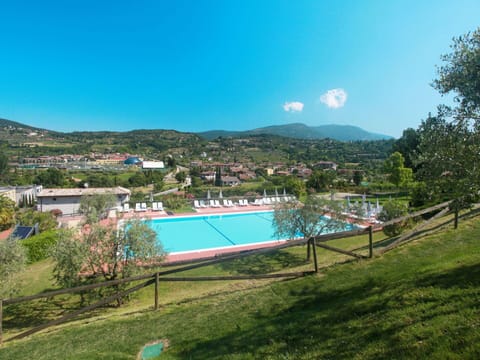 Water, Plant, Sky, Building, Mountain, Tree, Azure, Swimming Pool, Grass, Natural Landscape
