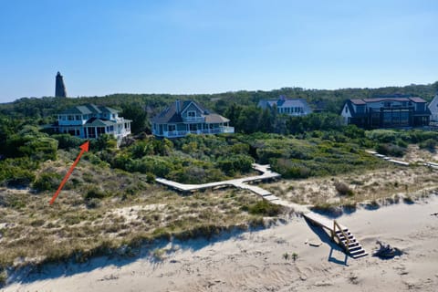 A walkway connects Green Teal to the beach