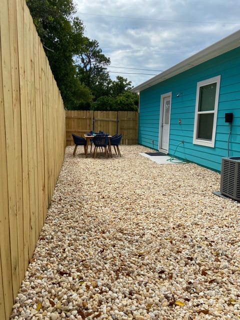 Outdoor dining area, fenced in yard, outdoor shower, 3 burner propane grill 