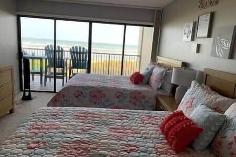 Master bedroom view with double queen beds