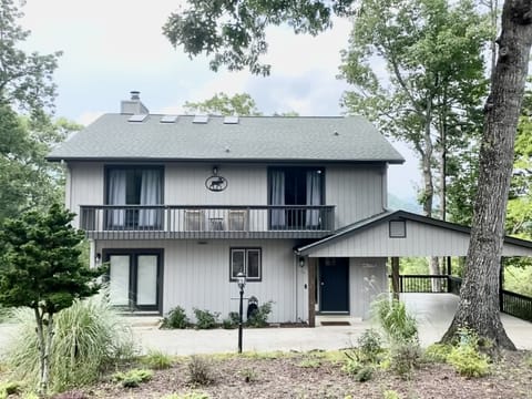 Circle driveway and car port. Great views from top level porch.