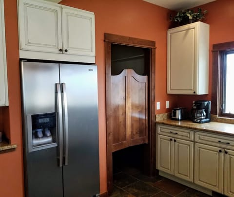The kitchen has great features including a walk in pantry.