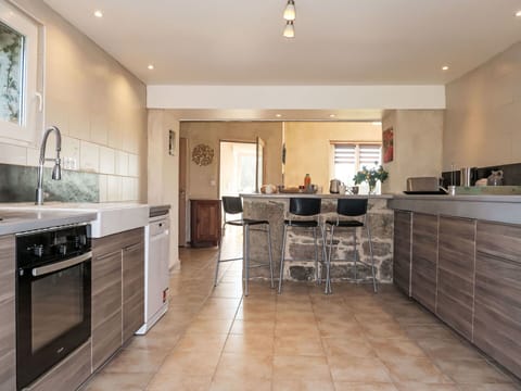 Furniture, Countertop, Kitchen, Cabinetry, Flooring, Interior Design, Floor, Kitchen Appliance, Wood, Ceiling