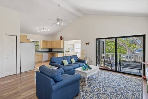 Bright and spacious living and dining area  with coastal decor