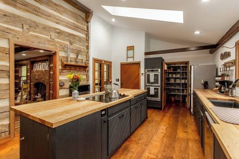 Kitchen complete with new stove, dishwasher, refrigerator, pantry, and two convection ovens for all your cooking needs.