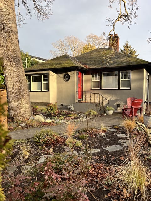 Street view & yard w/ a couple Adirondack chairs to enjoy late afternoon sun. 
