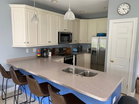 Kitchen with bar stools & large island